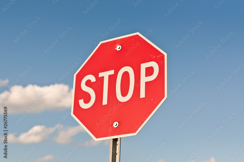 Stop Sign with Blue Sky and Clouds