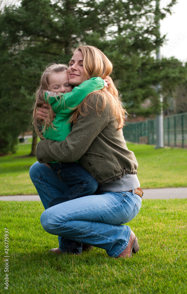 Mother and daughter hugging Mother and daughter hugging