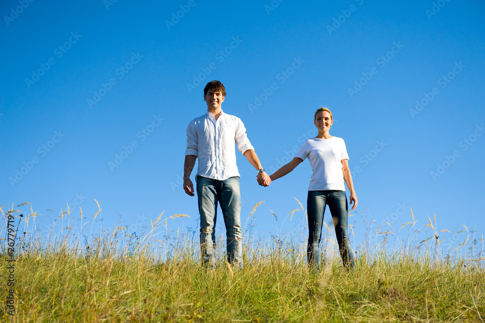 full-length portrait young couple standing outdoors full-length portrait young couple standing outdoors