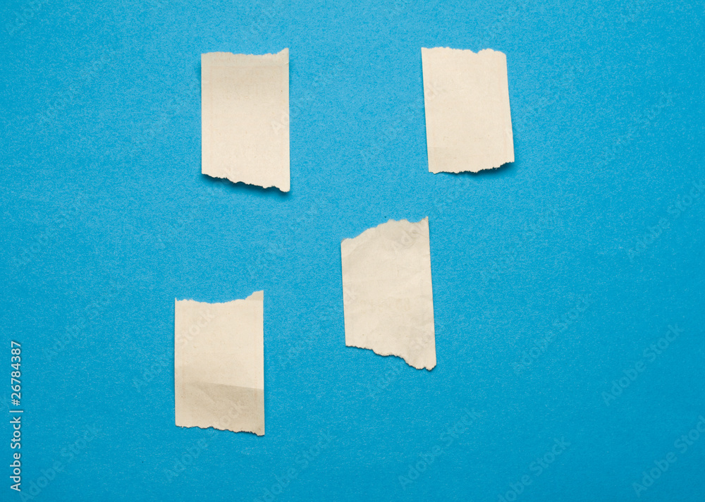 Fototapeta premium Scraps isolated on blue