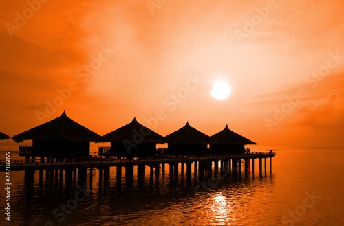 Sunset and water bungalows