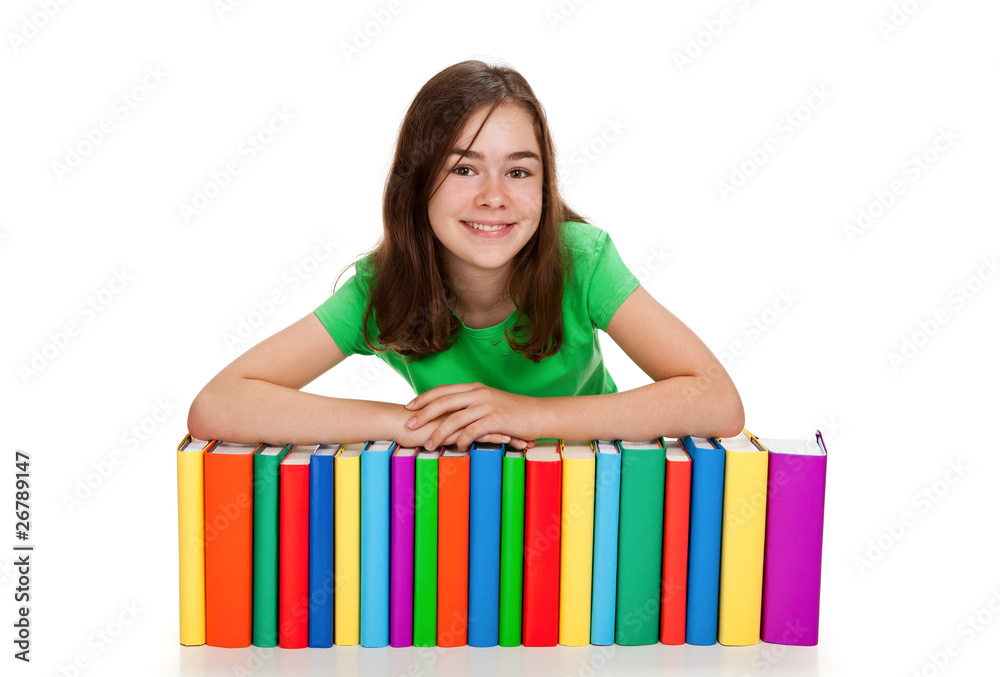Student sitting behind pile of books on white Student sitting behind pile of books on white