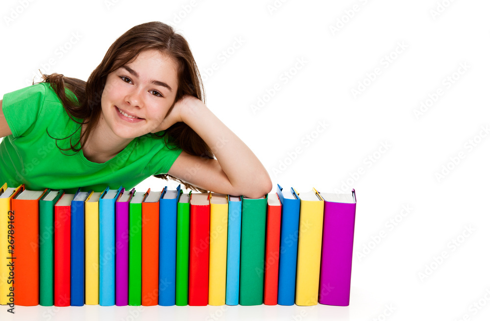 Student sitting behind pile of books on white Student sitting behind pile of books on white