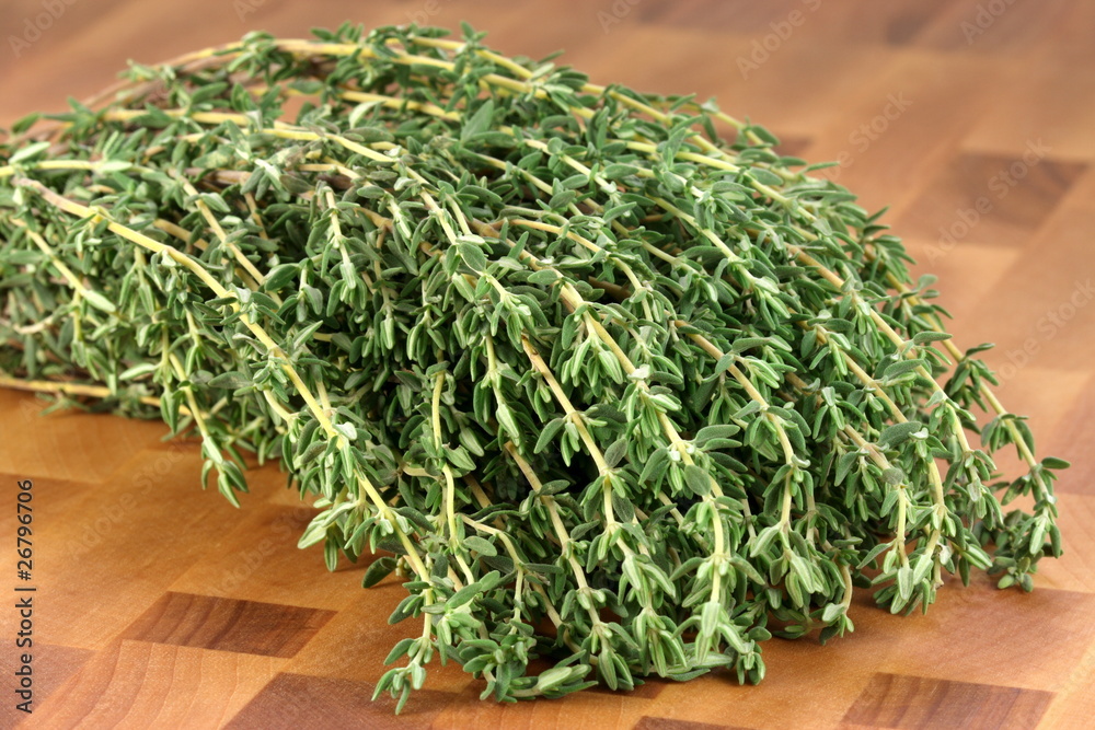 thyme on wood cutting board