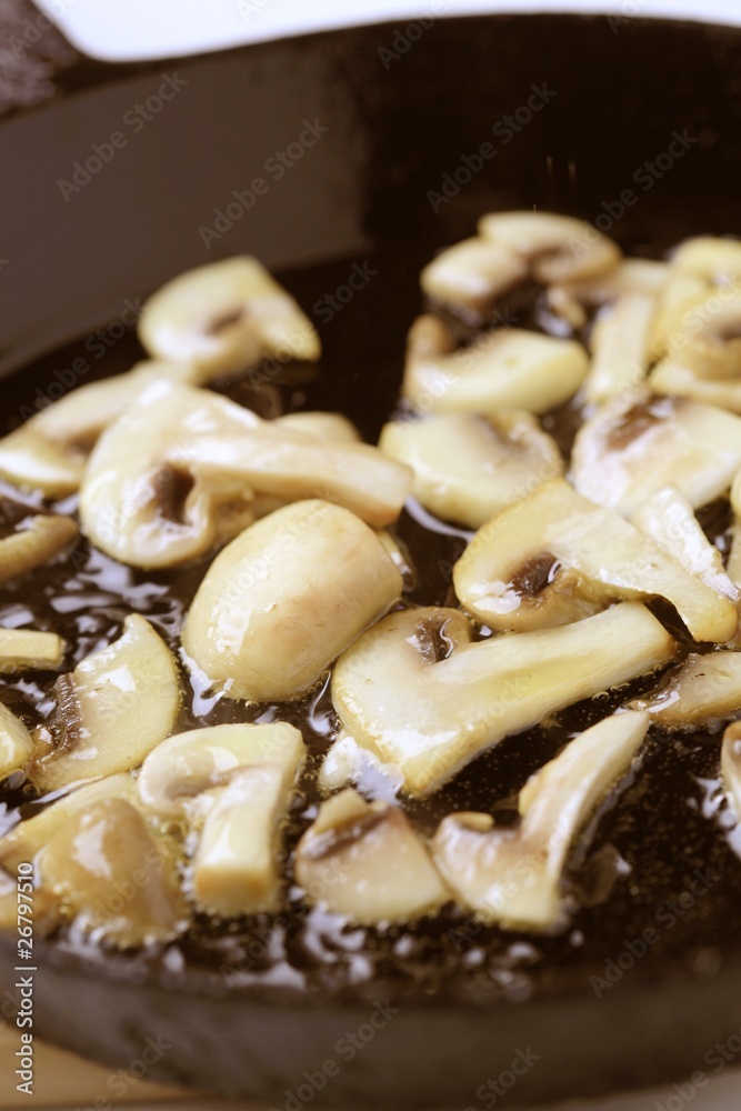 Button mushrooms on a pan Button mushrooms on a pan