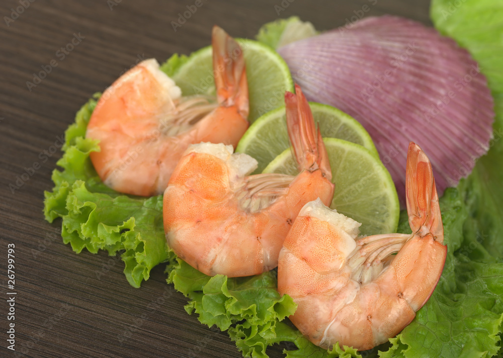 King prawn on lime, lettuce and purple shell King prawn on lime, lettuce and purple shell