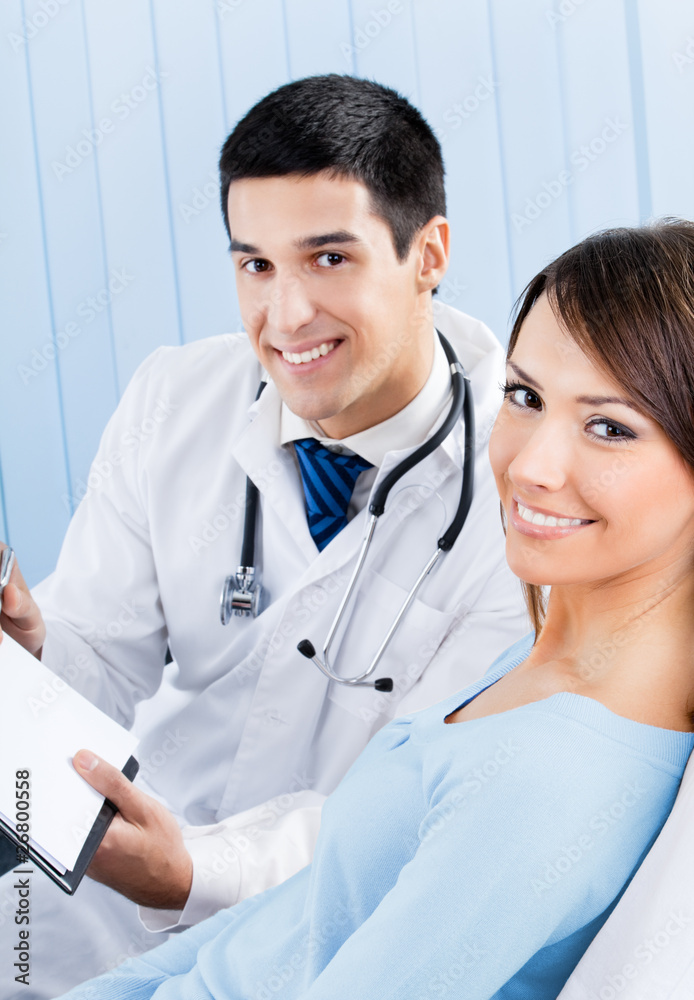 Doctor and patient with prescription at office Doctor and patient with prescription at office
