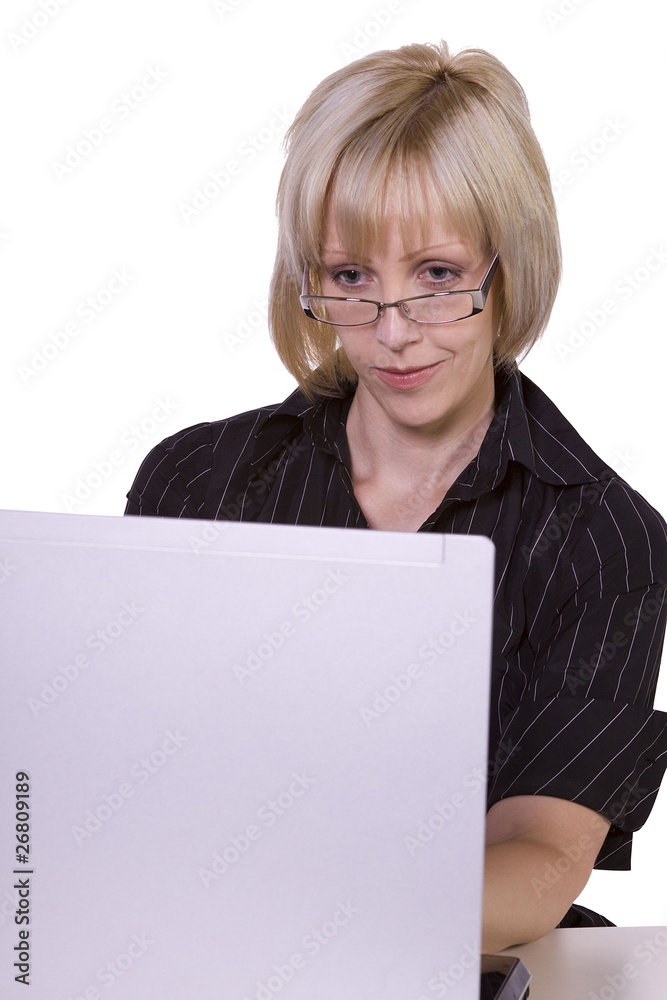 Businesswoman with glasses working on laptop Businesswoman with glasses working on laptop