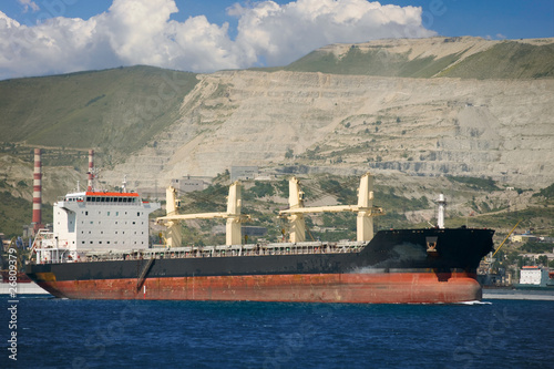 ship in the seaport against the mountains photo