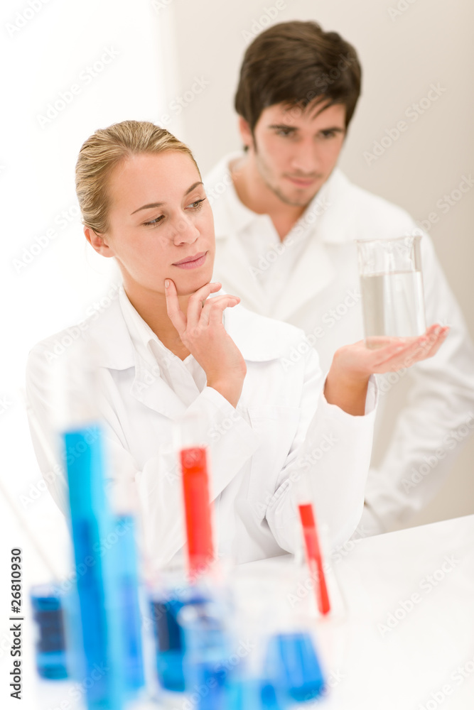 Scientists in laboratory test chemicals Scientists in laboratory test chemicals