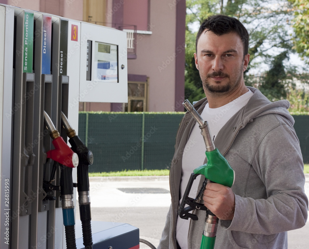 Customer Refilling Car at Gas Station Customer Refilling Car at Gas Station