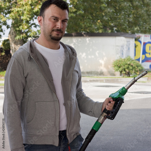 Customer Refilling Car at Gas Station