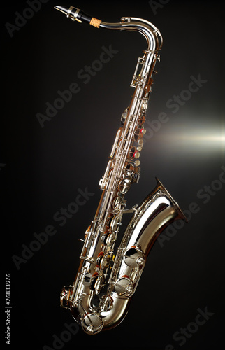 gold saxophone on black background