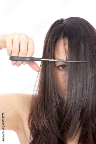 Young Woman Cutting Hair. Model Released