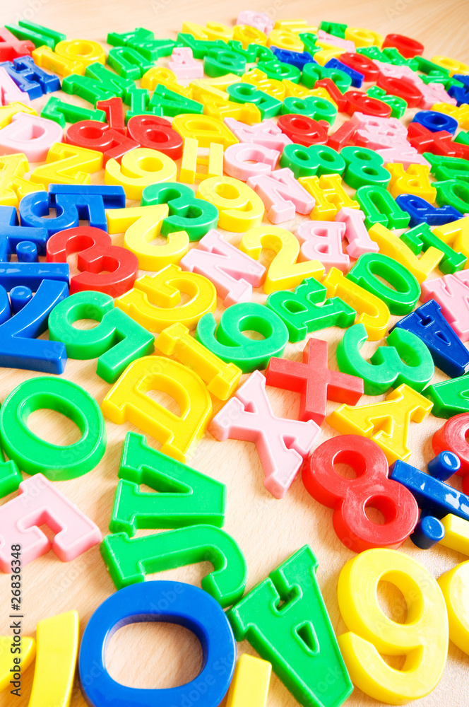 Naklejka premium Children letters and digits on the table