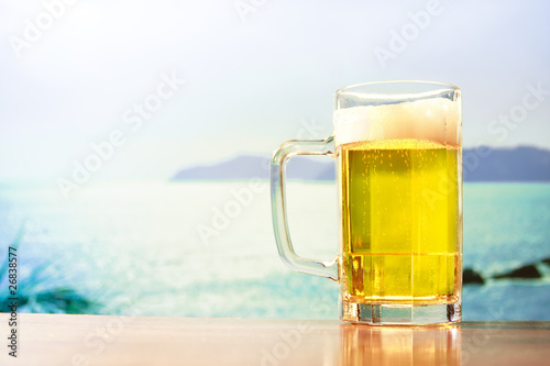 refreshing beer mug on the beach