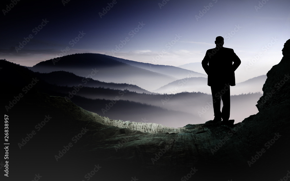 Valley with silhouette of a man