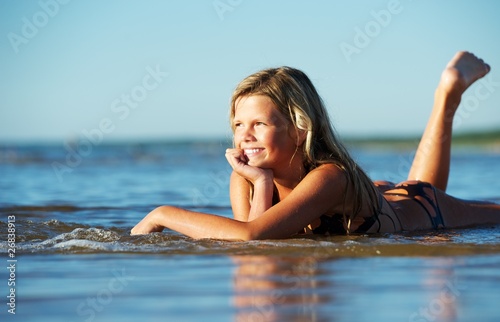 Happy girl relaxing in the water