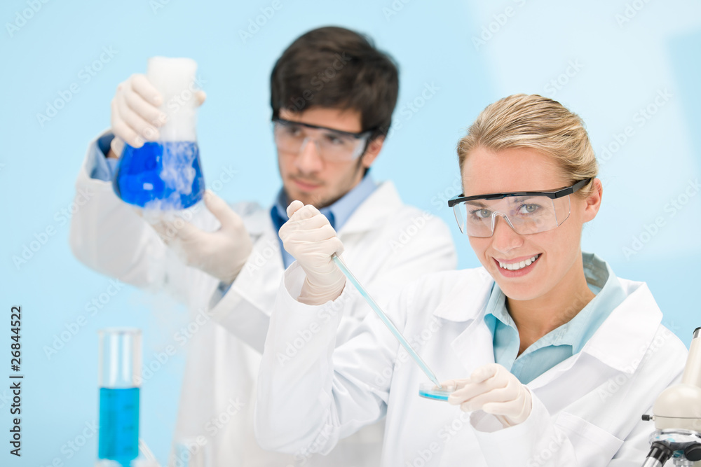 Flu virus experiment - scientist in laboratory Flu virus experiment - scientist in laboratory
