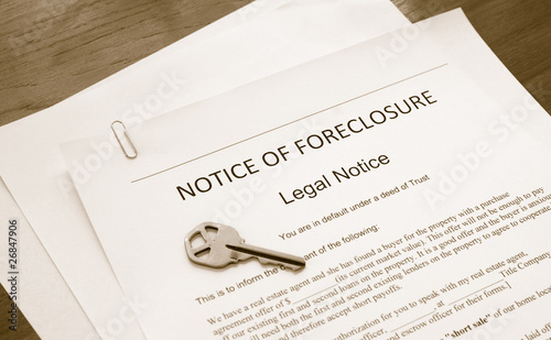home foreclosure legal document with house key photo