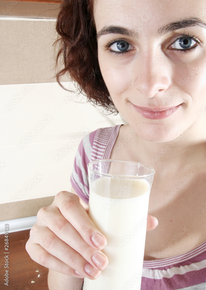 Young people eating milk with cereals Young people eating milk with cereals