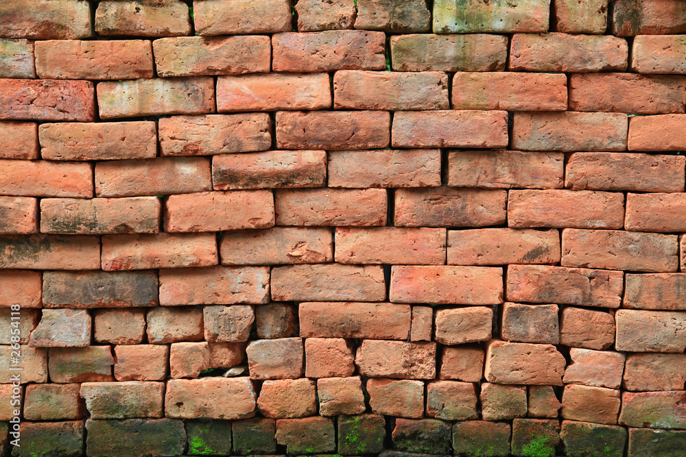 Fototapeta premium irregular shapes of red stone brick wall background