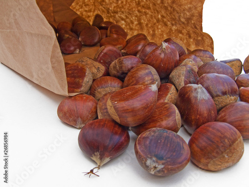 Chestnuts spilling from a paper bage