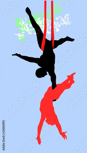 Modern circus acrobats: a man holding a woman in mid-air