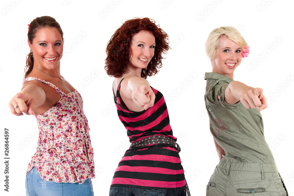 Three attractive young women pointing Three attractive young women pointing
