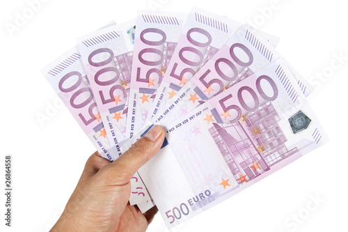 Hand holding 500 euro bills