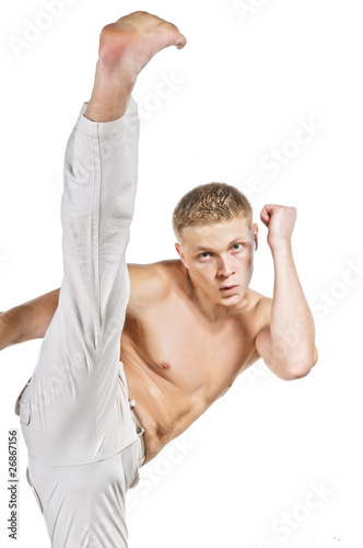 Street figter kicking with the leg photo