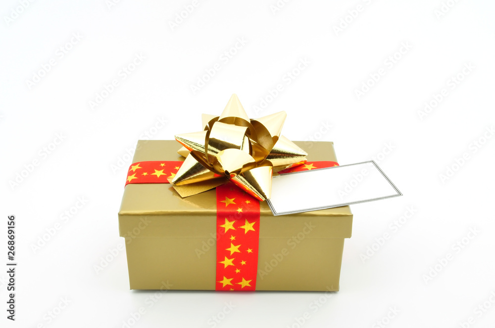 gold box with gold bow red ribbon and blank tag top view gold box with gold bow red ribbon and blank tag top view