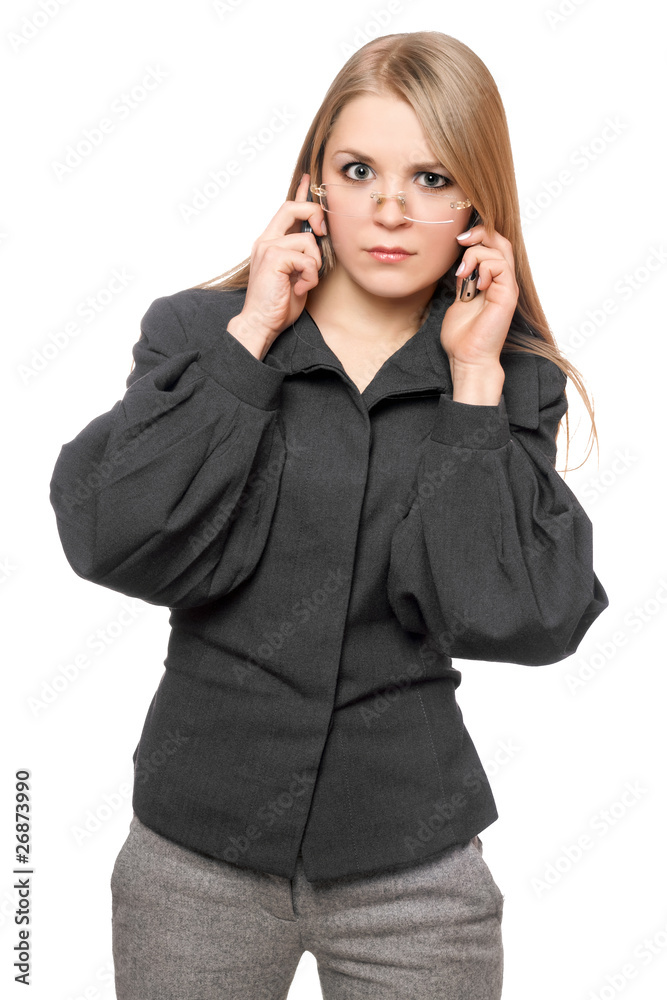 Portrait of discontented young blonde in a gray business suit Portrait of discontented young blonde in a gray business suit