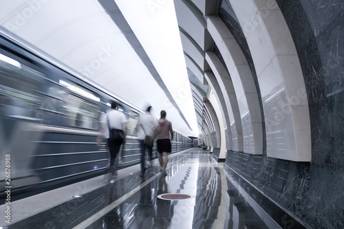 moving train and persons in metro station