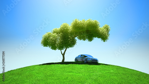 Modern vehicle under tree on green fileld photo