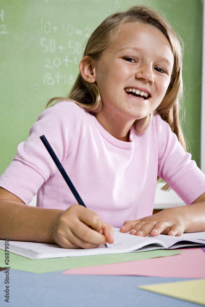Close-up of school girl writing in notebook Close-up of school girl writing in notebook