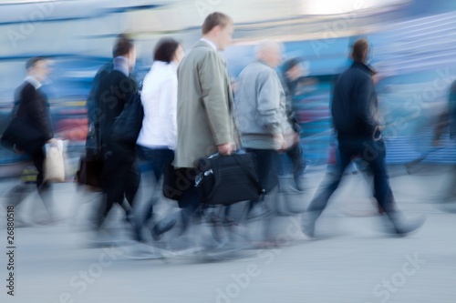Blurred image of people rushing to work in the morning