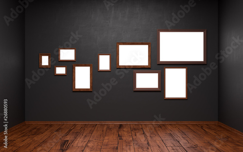 Blank pictures of different sizes in a dark room