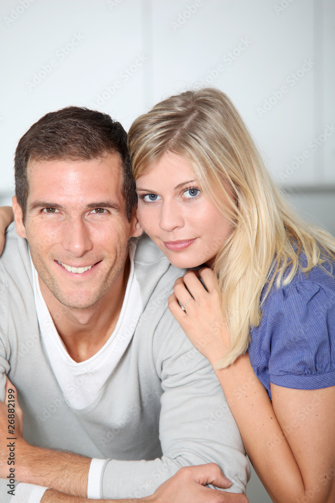 Smiling couple standing in home kitchen Smiling couple standing in home kitchen