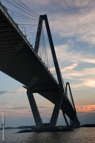 View of Large Bridge from Underneath during Sunset