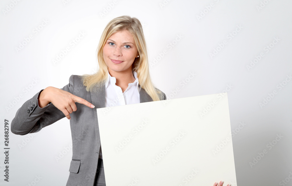 Businesswoman holding white panel Businesswoman holding white panel