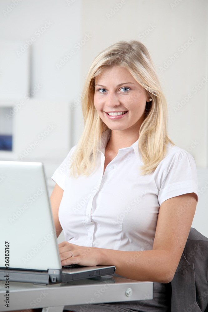 Beautiful smiling young woman working in the office Beautiful smiling young woman working in the office