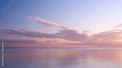 Sunset clouds timelapse over the calm sea