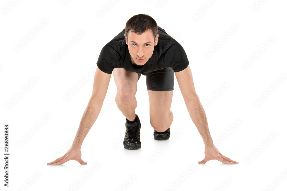 Full length portrait of a male athlete ready to run Full length portrait of a male athlete ready to run