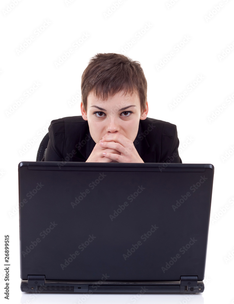 pensive woman working on laptop