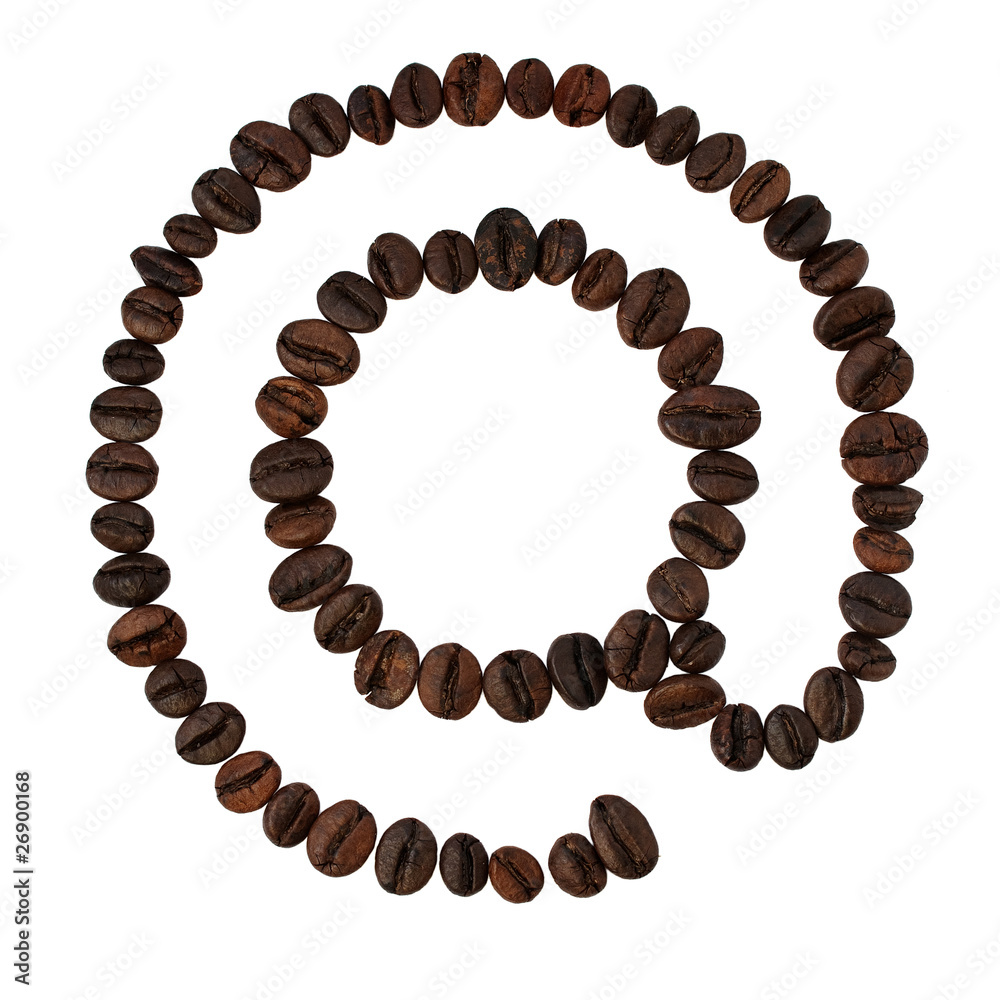 coffee beans lying in the shape of at sign coffee beans lying in the shape of at sign