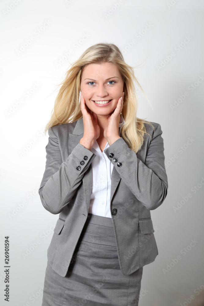 Blond businesswoman doing expressions on white background