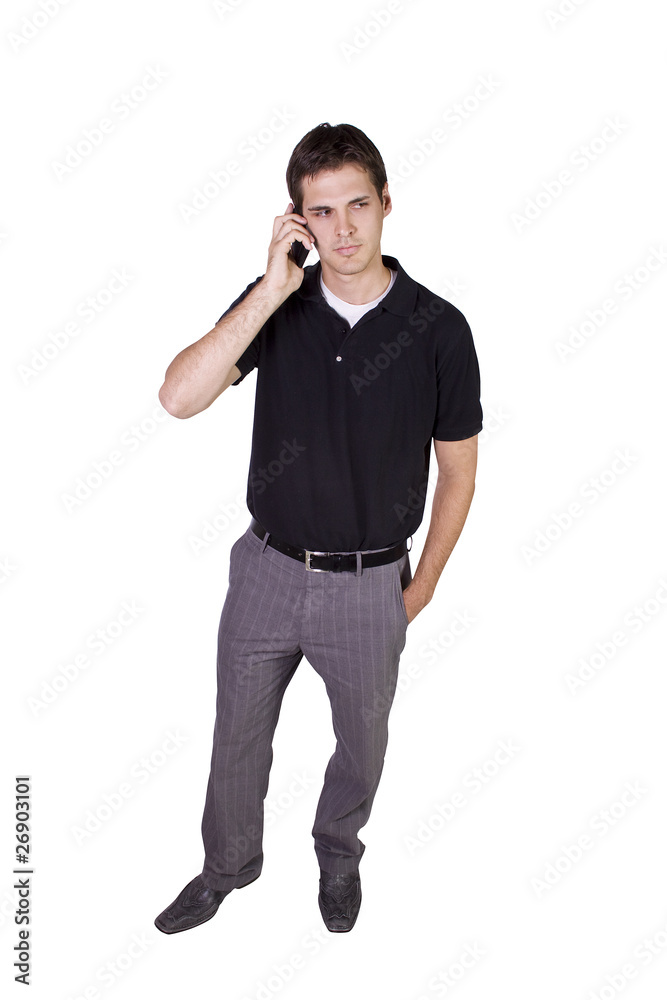 Young businessman conversing on cell phone Young businessman conversing on cell phone