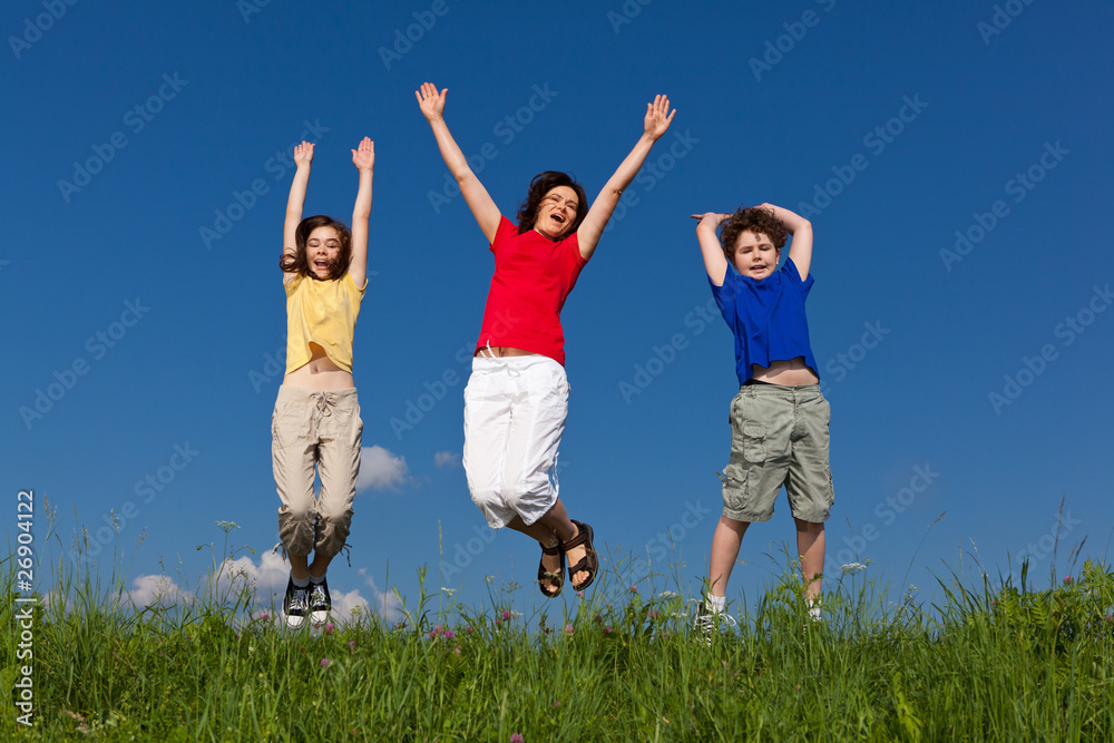 Active family - mother and kids jumping outdoor Active family - mother and kids jumping outdoor