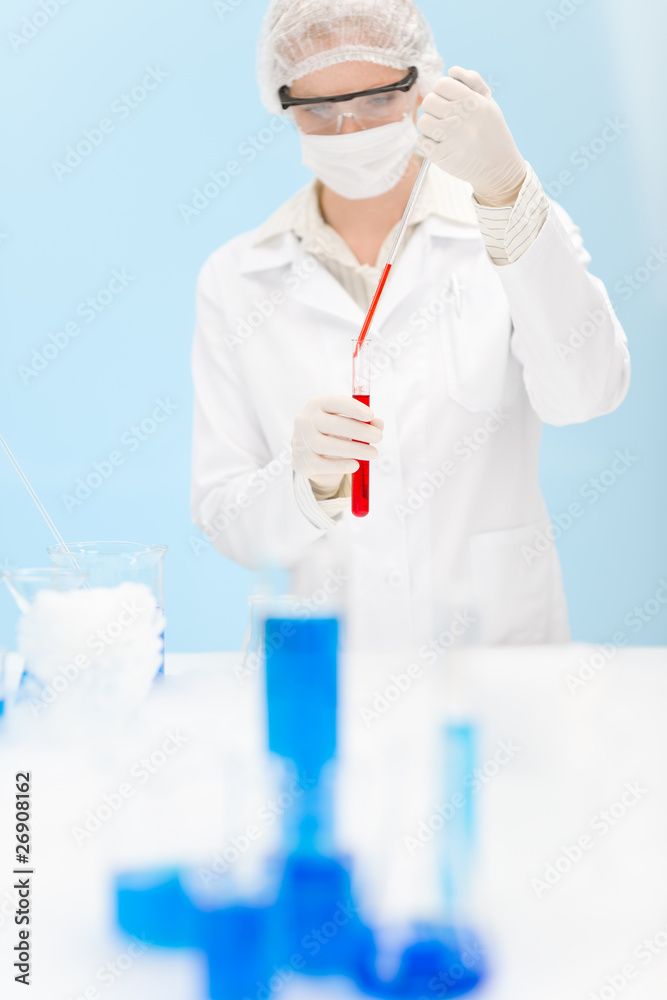 Flu virus vaccination research - woman scientist in laboratory Flu virus vaccination research - woman scientist in laboratory